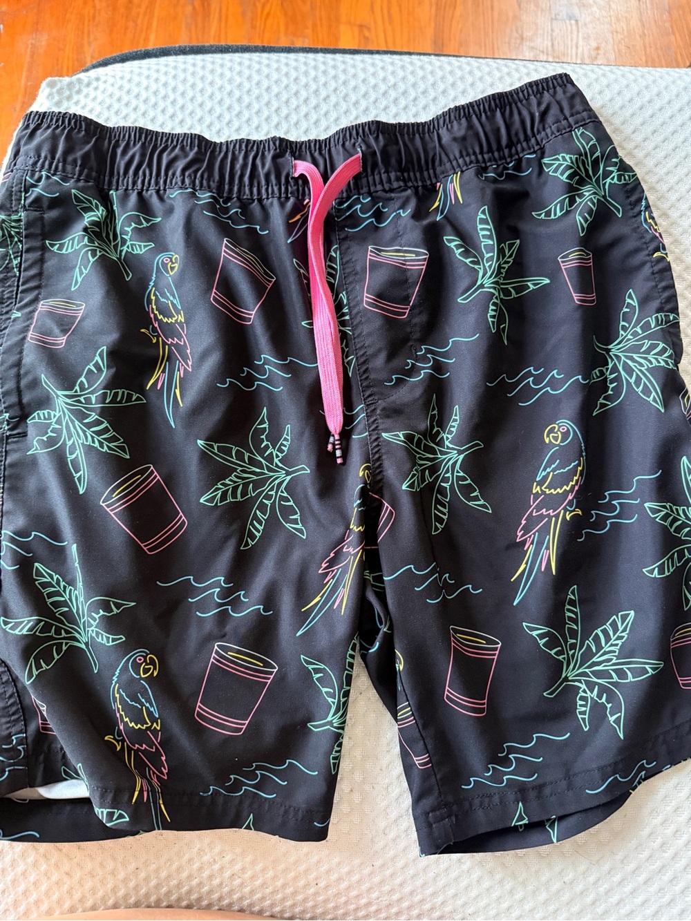 Valor M men’s Black Tropical Parrot Swim Trunks with Pink Drawstring